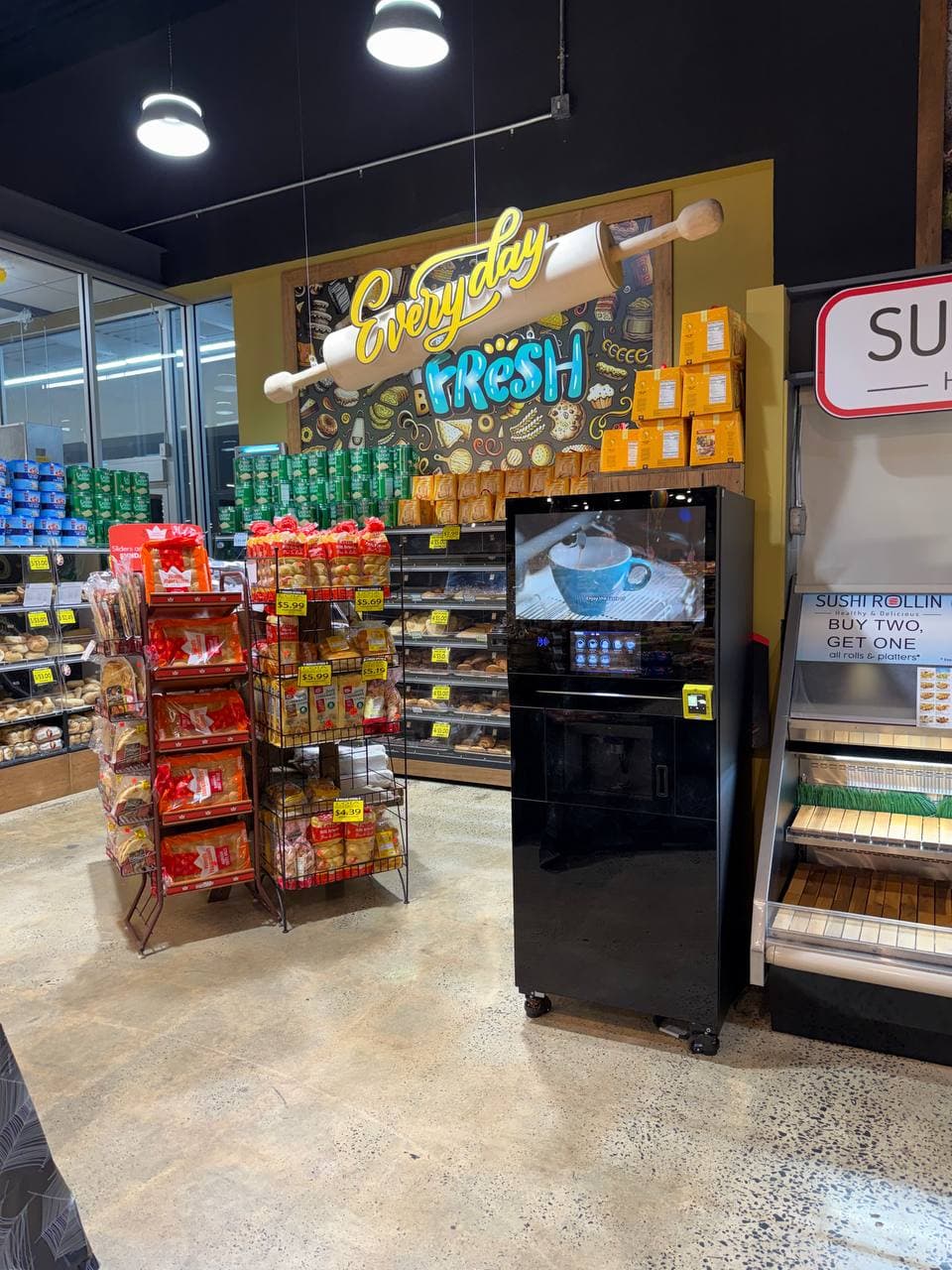 Coffee kiosk near a bakery section in a retail store