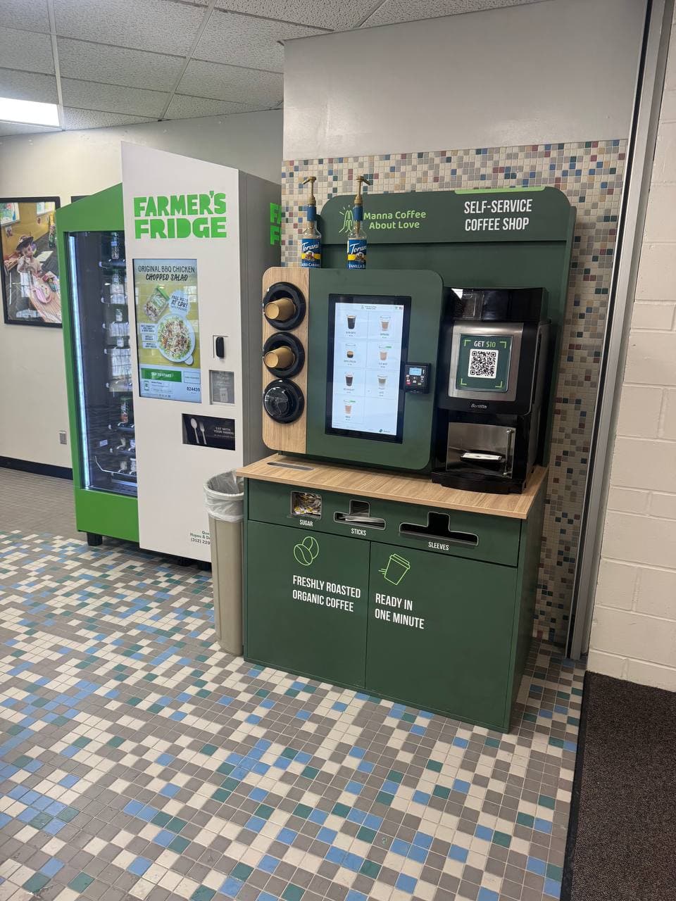 Self-service coffee kiosk installed in a break room alongside a Farmer's Fridge